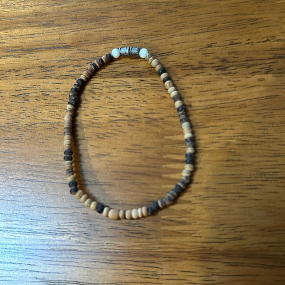 Wood seed bead bracelet. Not stretchy, real wood. Screw clasp.